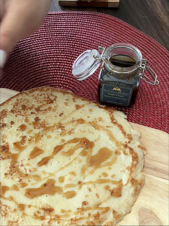 Louvila Honey drizzled over crepes at the table