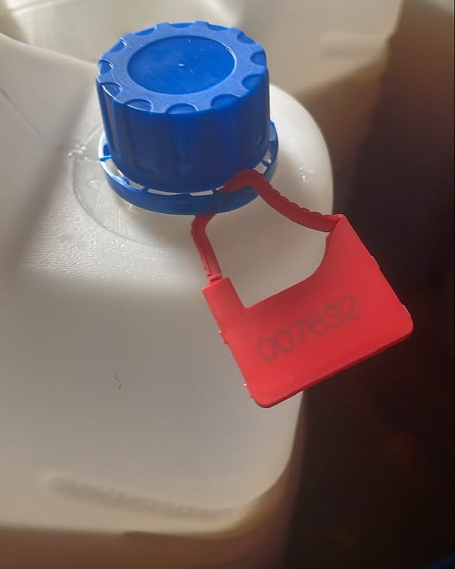 Tamper seal 007632 on a jerrican before pickup, Kinshasa